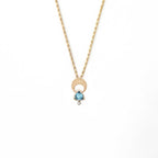 Above and Below necklace in 14k gold with hand-engraved crescent moon, trillion aquamarine and diamond