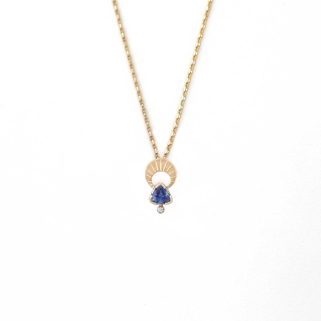 Above and Below necklace in 14k gold with hand-engraved crescent moon, trillion tanzanite, and diamond