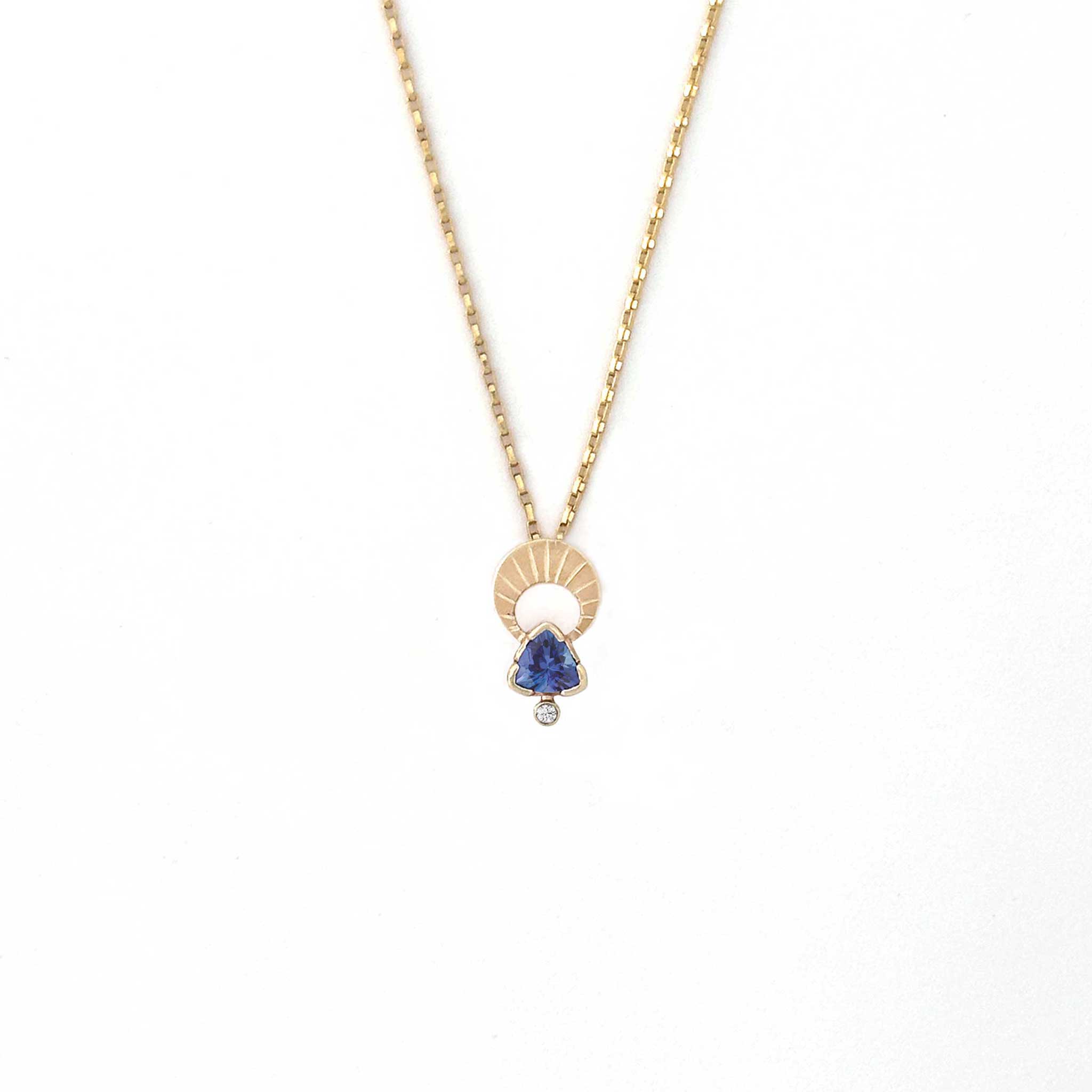 Above and Below necklace in 14k gold with hand-engraved crescent moon, trillion tanzanite, and diamond
