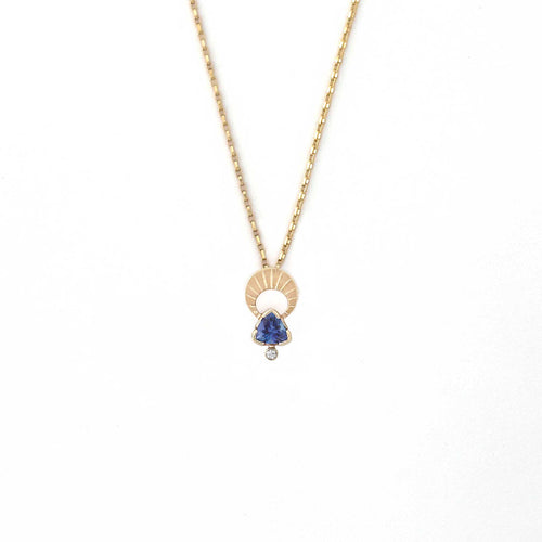 Above and Below necklace in 14k gold with hand-engraved crescent moon, trillion tanzanite, and diamond