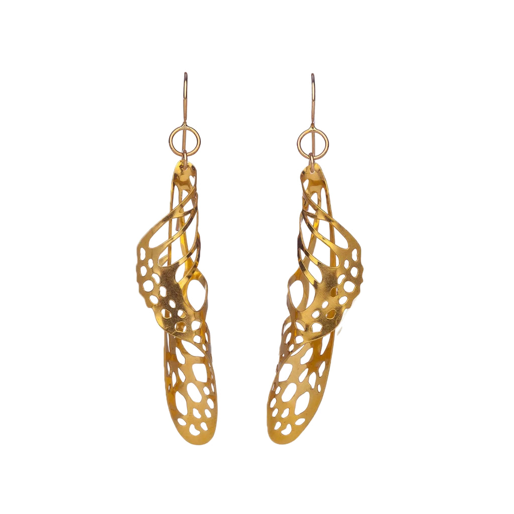 Gold swirl butterfly wing earrings with intricate design on a white background