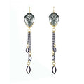 Pair of long, mixed metal 24k gold and silver dangling Cocoon Chanelier butterfly earrings with tassels on a white background