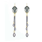 Pair of long, mixed metal 24k gold and silver dangling Cocoon Chanelier butterfly earrings with tassels on a white background