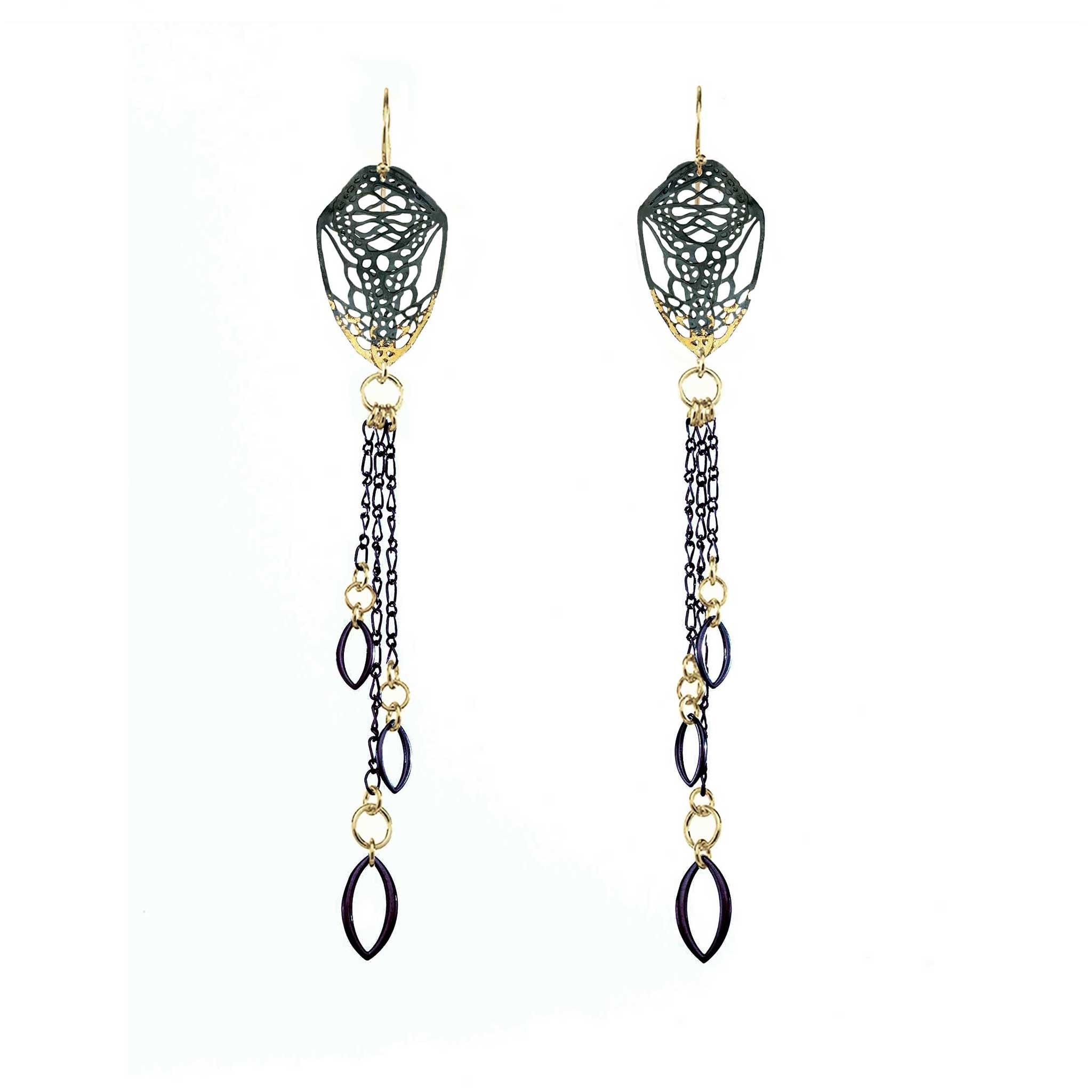 Pair of long, mixed metal 24k gold and silver dangling Cocoon Chanelier butterfly earrings with tassels on a white background