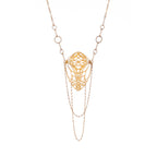 Close-up of 2-inch butterfly cocoon pendant from Opera Length Diaphanous necklace showing intricate cutwork