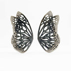 Flight butterfly oxidized silver ear crawlers  on a white background. 