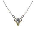 Keum-boo butterfly necklace with a heart-shaped mixed metal 24k gold and silver pendant and 14k gold accents on a white background