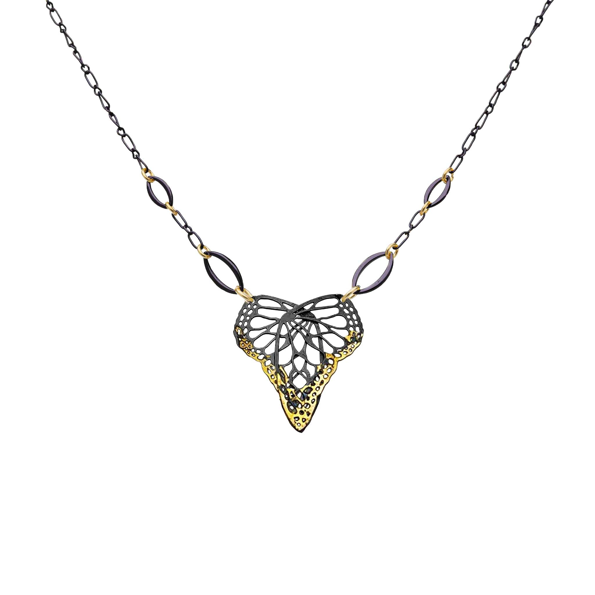 Keum-boo butterfly necklace with a heart-shaped mixed metal 24k gold and silver pendant and 14k gold accents on a white background