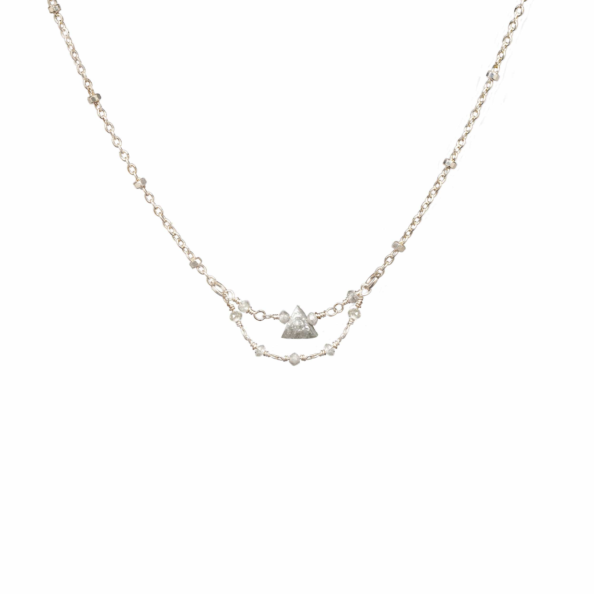 Grey Dawn silver necklace with a 4 mm raw grey triangle diamond pendant on a white background