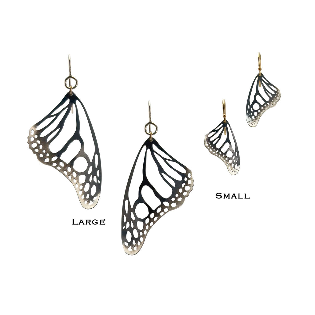 Monarch butterfly black and silver wing earrings in large and small sizes on a white background