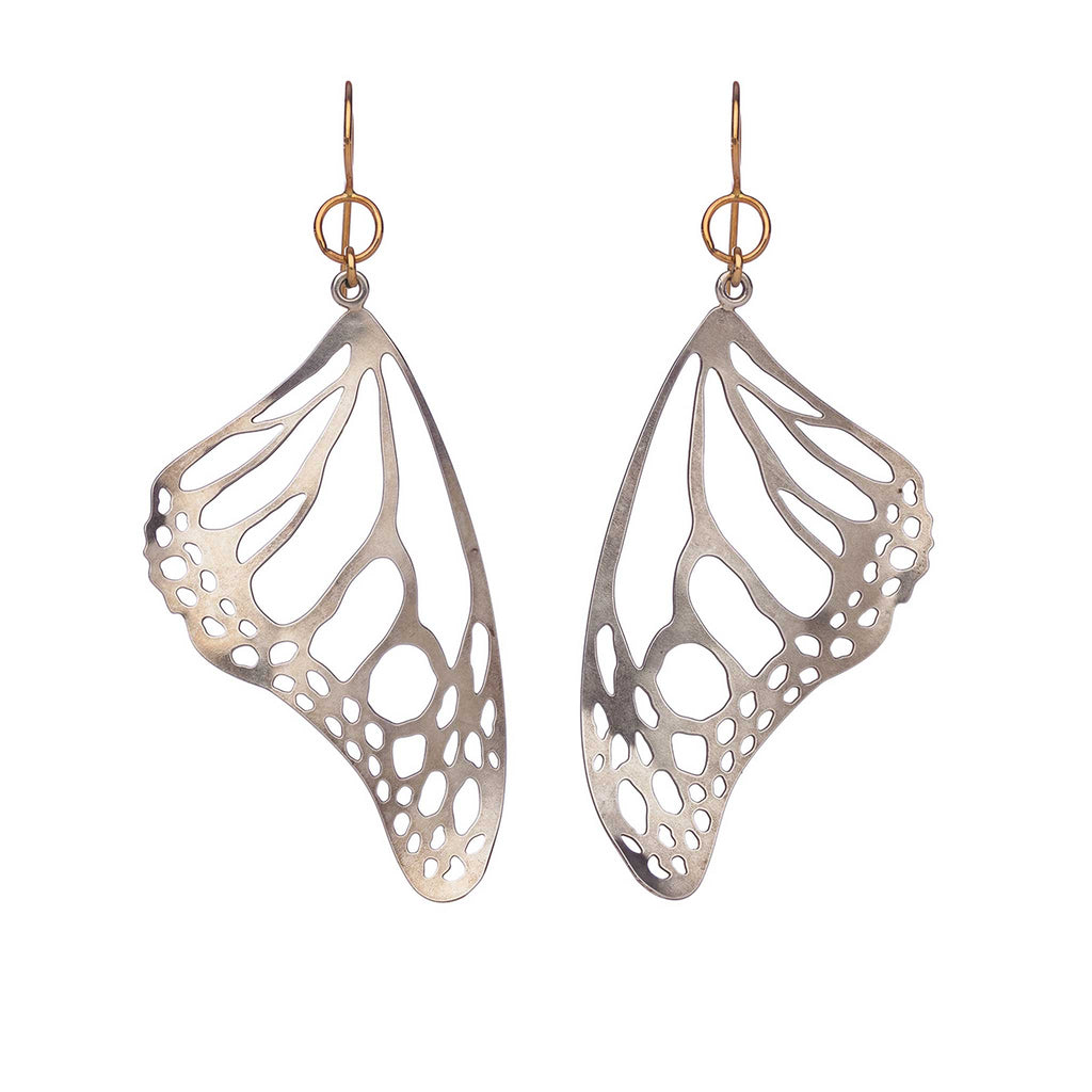 Pair of silver Monarch butterfly wing earrings on a white background