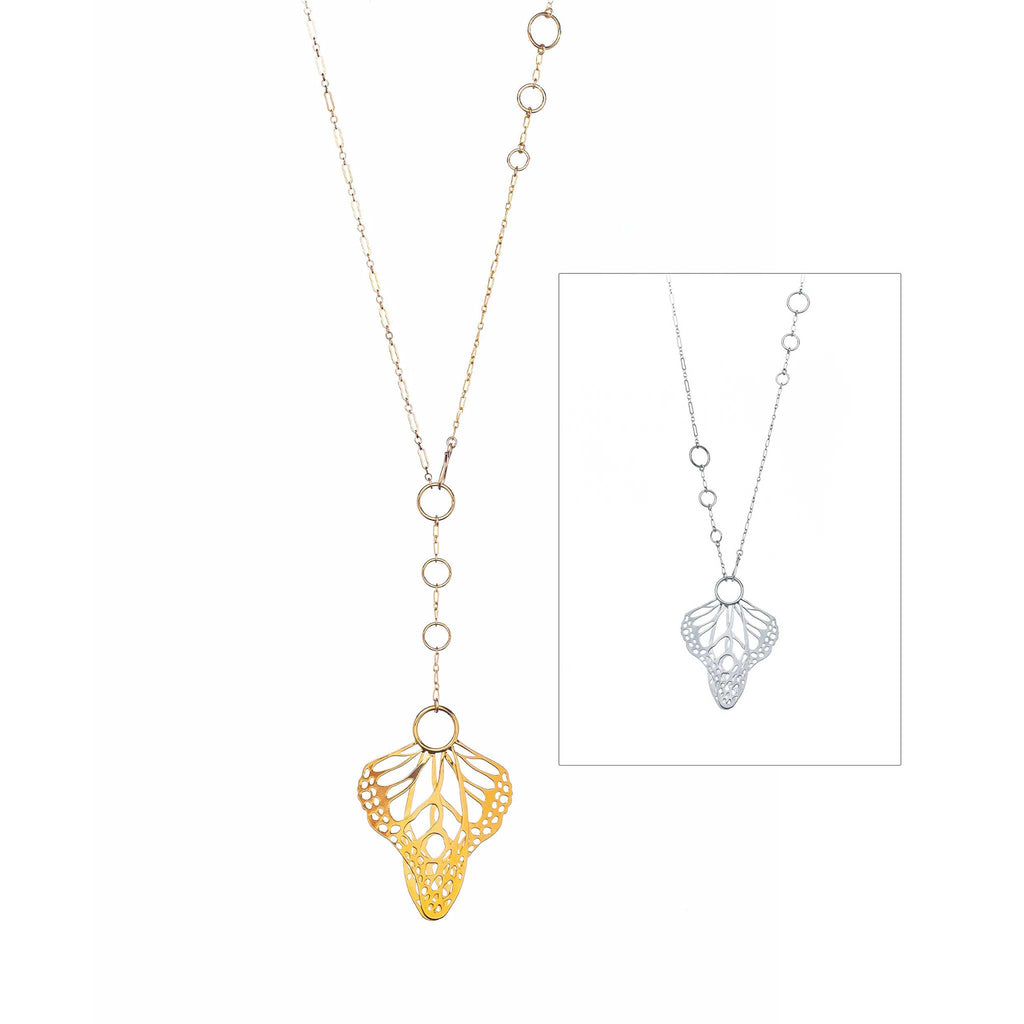 Gold and silver Metamorphosis lariats, showing different ways to clasp on a white background