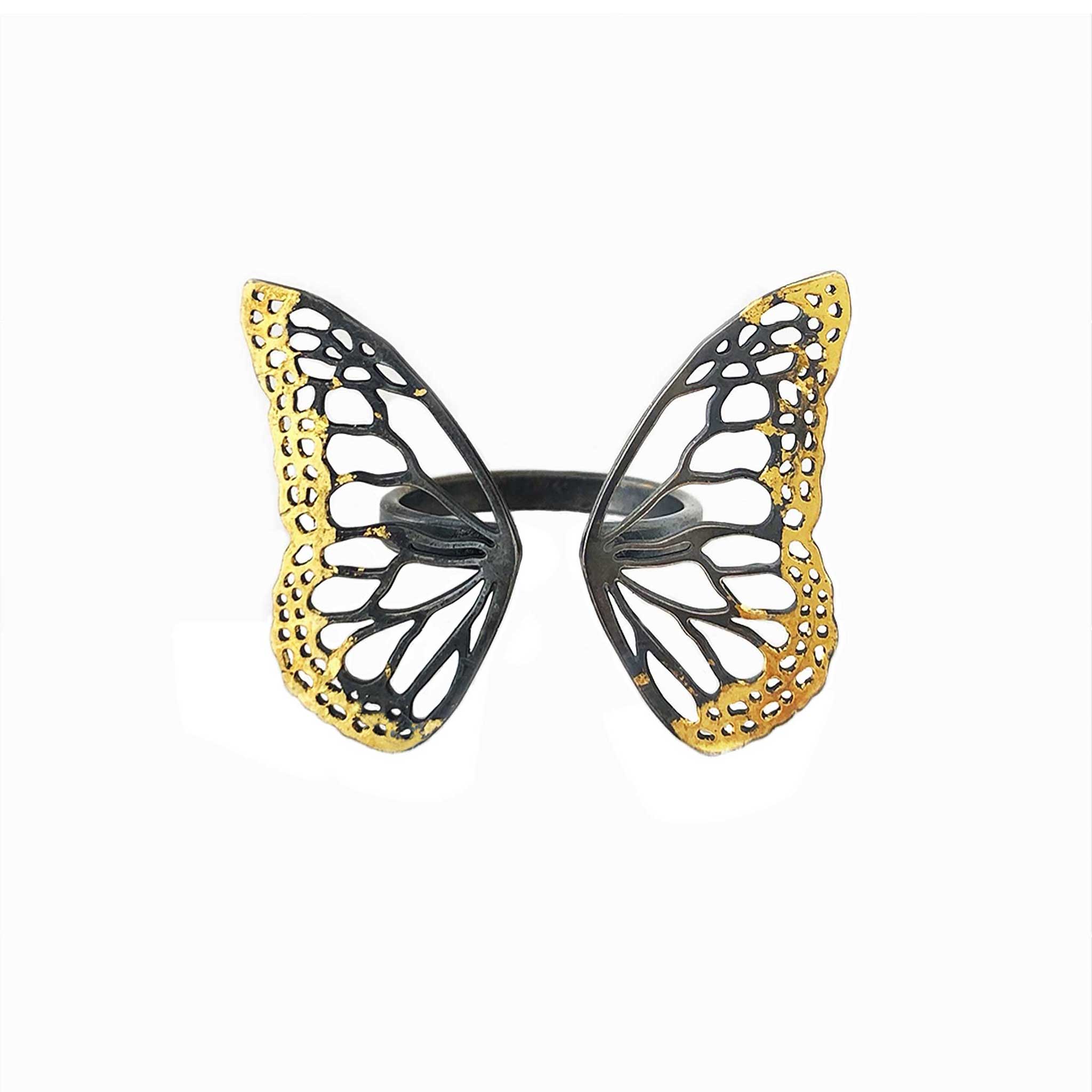 Migration ring showing hand-crafted 24K gold Keum-boo technique on oxidized sterling silver butterfly