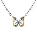 Butterfly necklace with mixed metal gold and black design on a white background