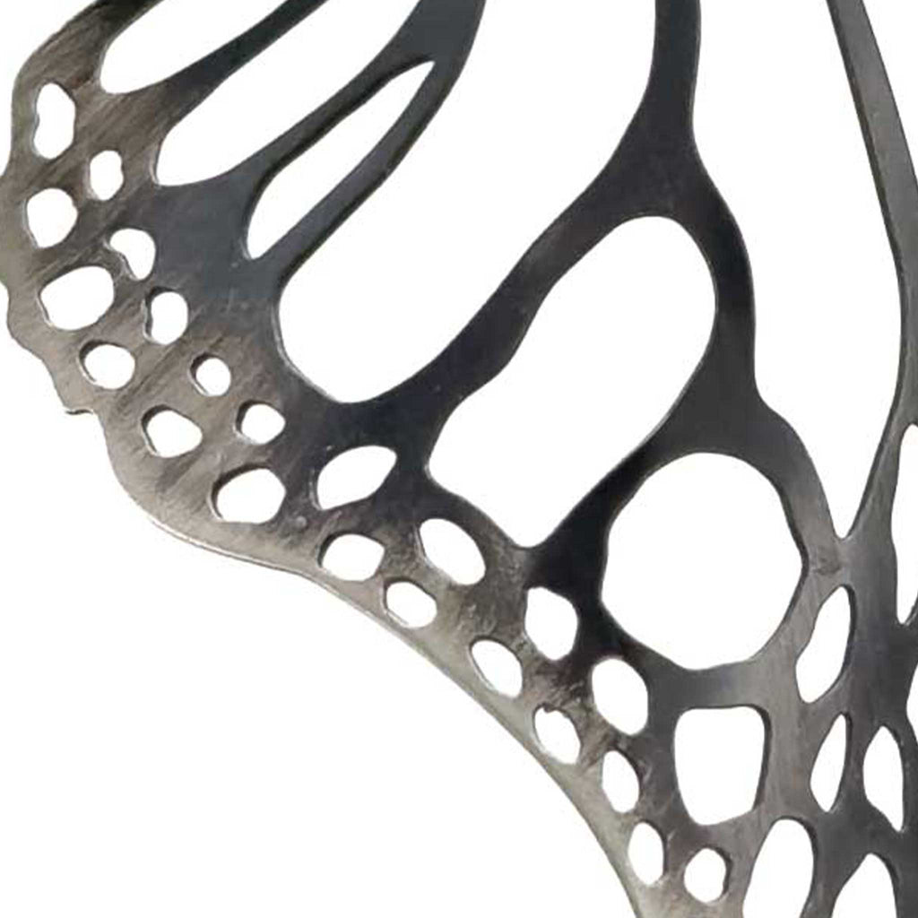 swatch example of oxidized patina on sterling silver on a white background