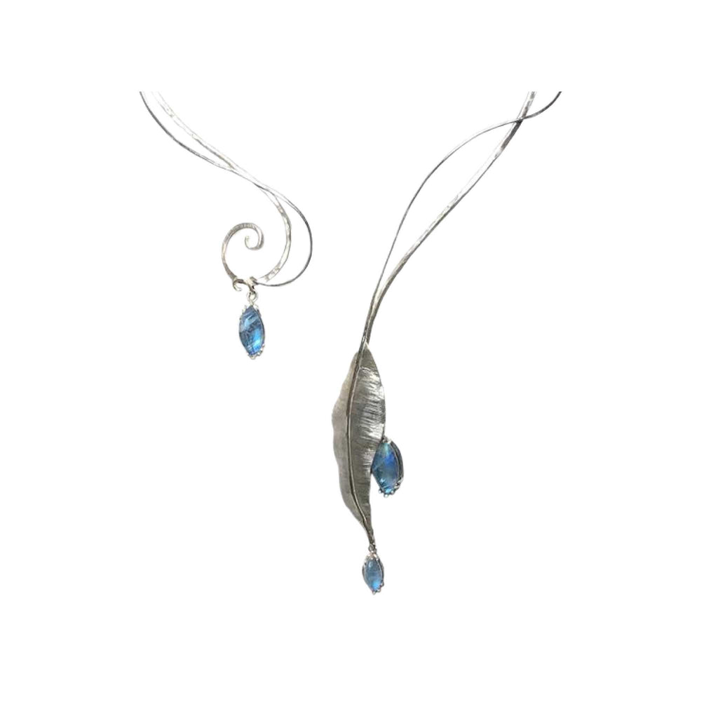 Close-up of Summer Rain collar showing hand-forged sterling silver vine work and marquise moonstone cabochons