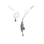 Close-up of Summer Rain collar showing hand-forged sterling silver vine work and marquise moonstone cabochons