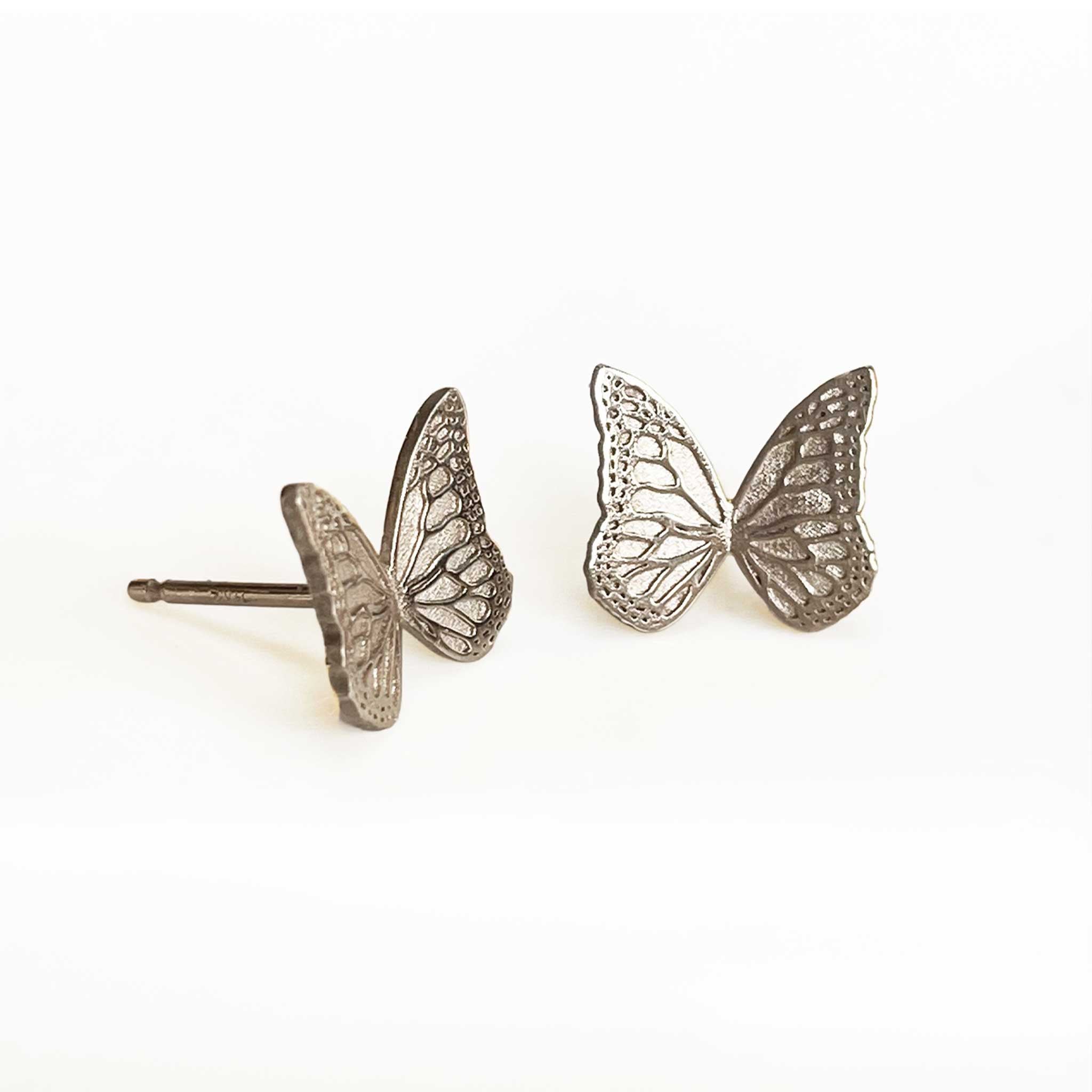Silver Whisper butterfly stud earrings on a white background