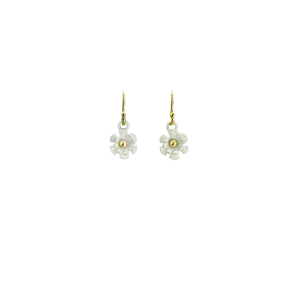 Blossom earring showing three-dimensional white matte silver petals with 14K gold ball center on white background