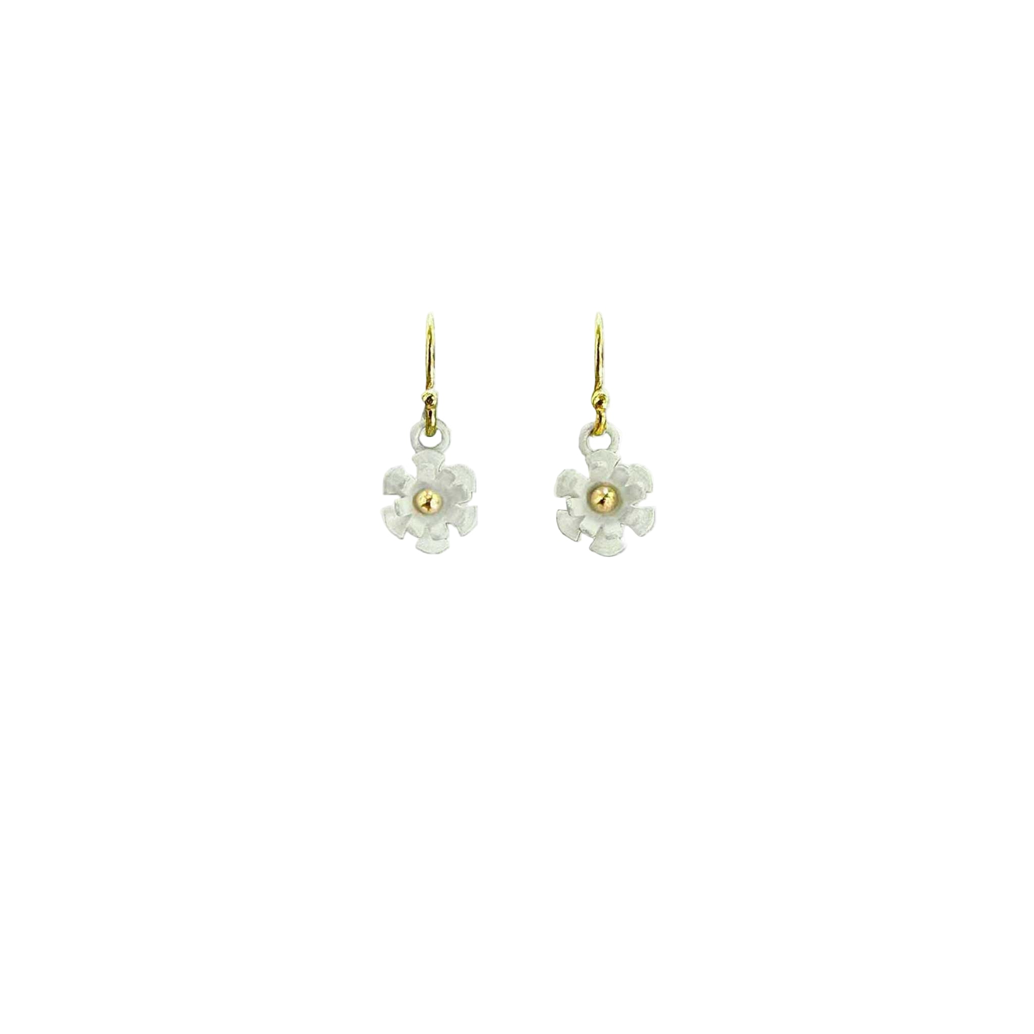 Blossom earring showing three-dimensional white matte silver petals with 14K gold ball center on white background