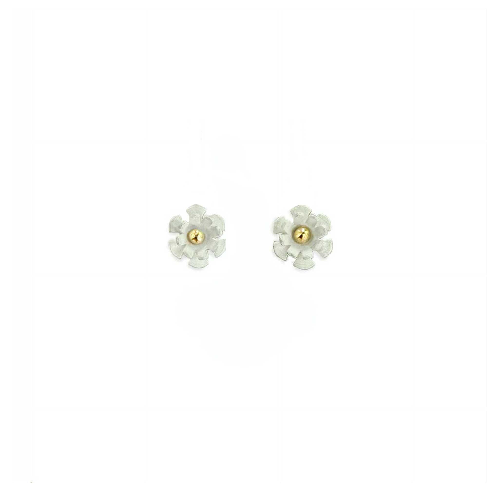 Close-up of 7mm Blossom stud showing white matte silver petals with warm 14K gold ball center