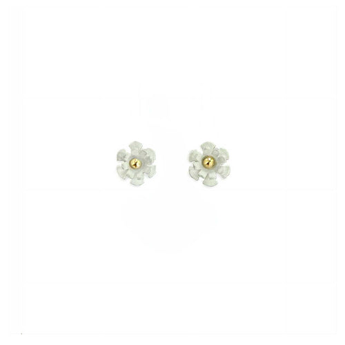 Close-up of 7mm Blossom stud showing white matte silver petals with warm 14K gold ball center