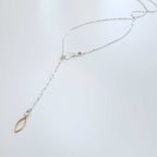 Blossom silver and vermeil necklace hook clasp with a gold marquise charm at the end of a 2 inch extension on a white surface | Camille Torres Designs