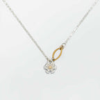 Floral pendant silver necklace with a mixed metal floral pendant and a gold center on a white background | Camille Torres Designs