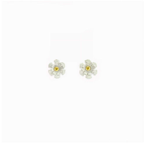 Close up of 7mm Blossom stud showing white matte silver petals with sparkling 1.7mm yellow sapphire in gold center