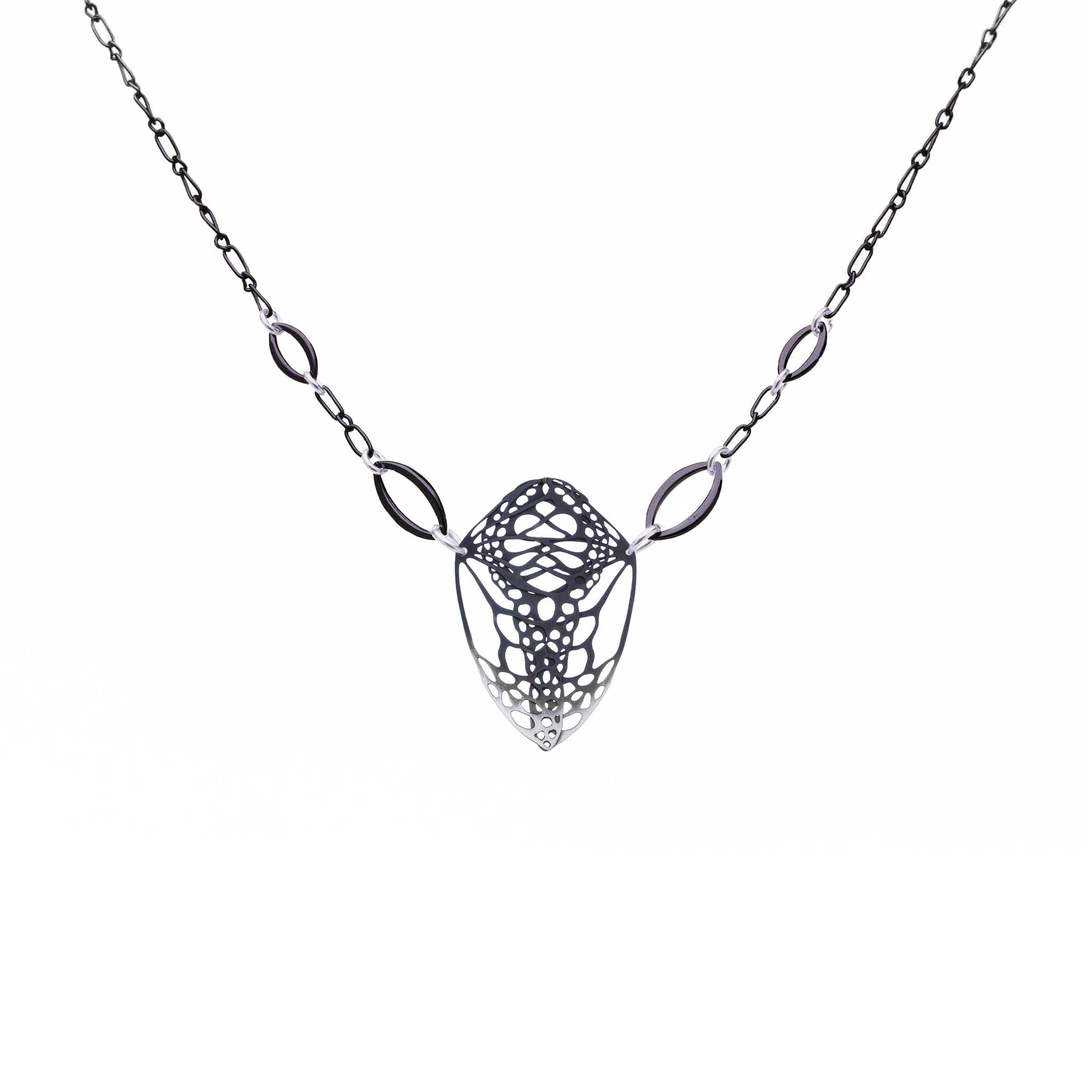 Cocoon butterfly necklace in oxidized sterling silver on a white background