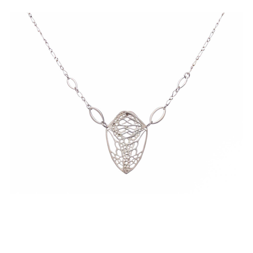 Cocoon butterfly wing pendant necklace handcrafted in sterling silver on a white background | Camille Torres Designs