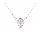 Cocoon butterfly wing pendant necklace handcrafted in sterling silver on a white background | Camille Torres Designs