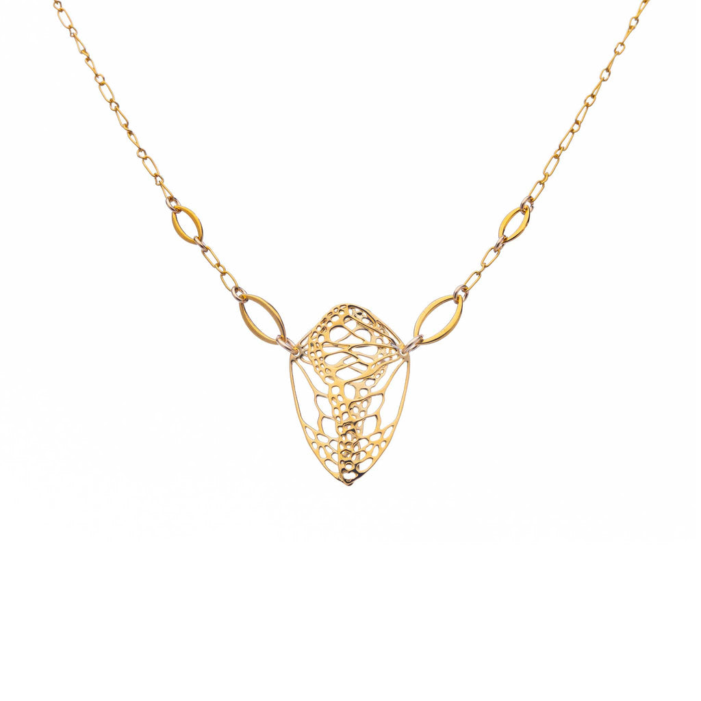 Cocoon butterfly wing necklace in gold on a white background