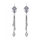 Pair of oxidized silver cocoon butterfly chandelier earrings with tassels, finished with a marquise charm on a white background | Camille Torres Designs