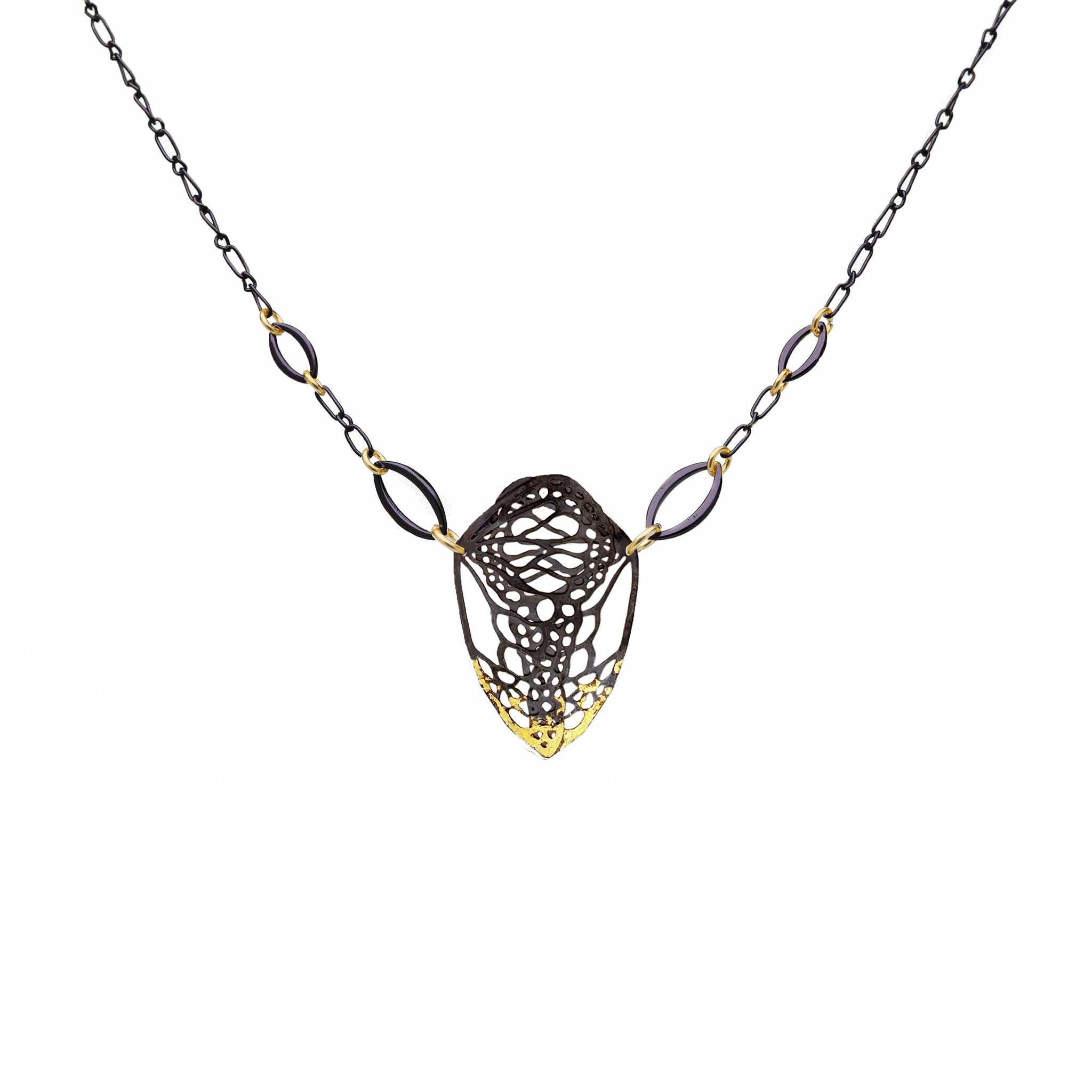Cocoon monarch necklace in 24k gold gilded oxidized sterling silver keum-boo on a white background