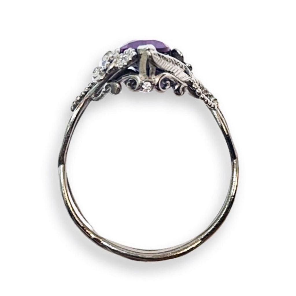 bridge view of custom floral engagement ring with a colored marquise gem in white gold and diamond accents over a white background | Camille Torres Designs
