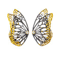 Butterfly wing ear climbers with gold and black design and diamonds on a white background