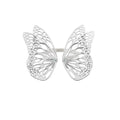 Flight butterfly ring in bright sterling silver with intricate cutout wing pattern, 1-inch adjustable band and Diamond accents over a white background | Camille Torres Designs