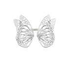 Flight butterfly ring in bright sterling silver with intricate cutout wing pattern, 1-inch adjustable band and Diamond accents over a white background | Camille Torres Designs