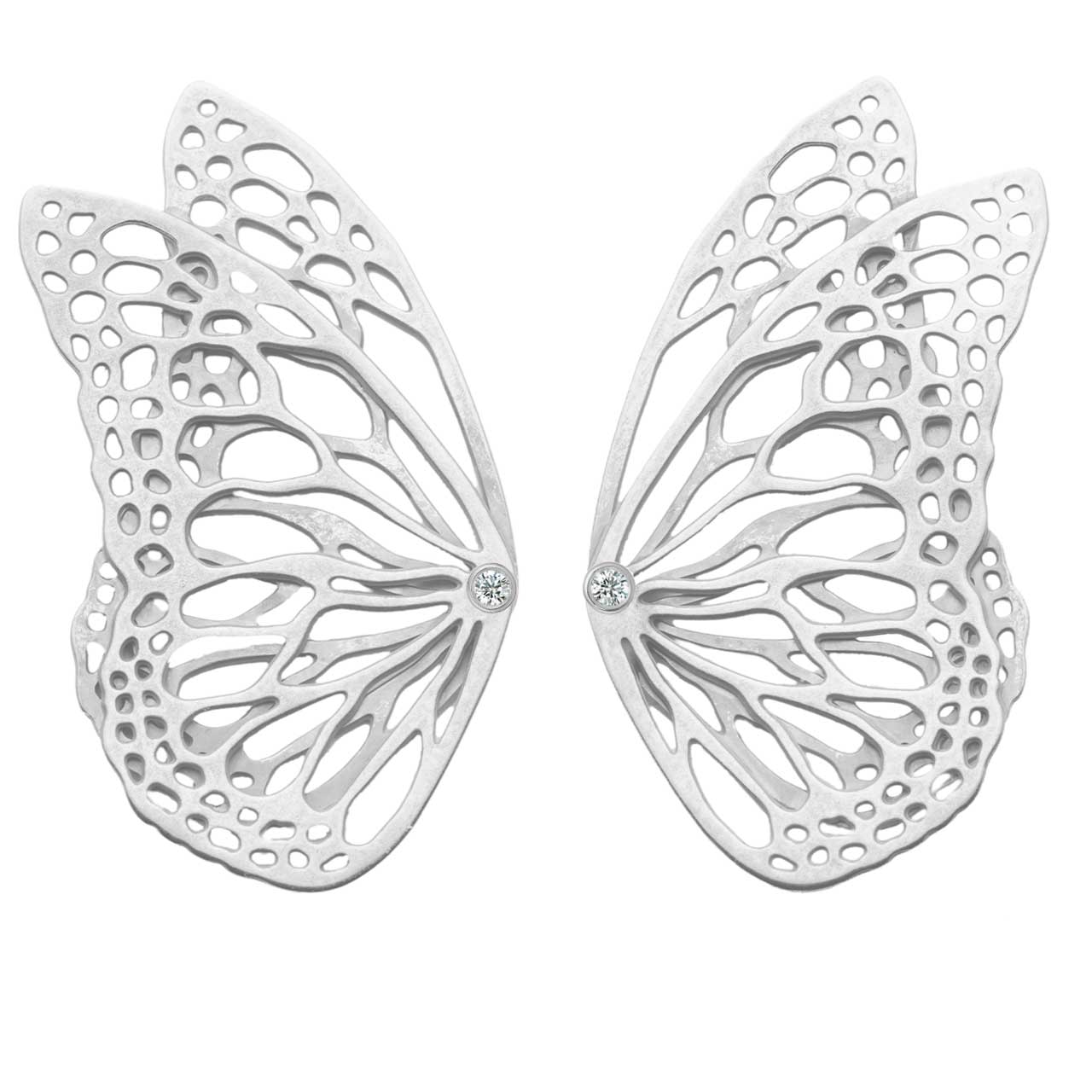 Flight monarch ear climbers in oxidized sterling silver with diamonds one a white background