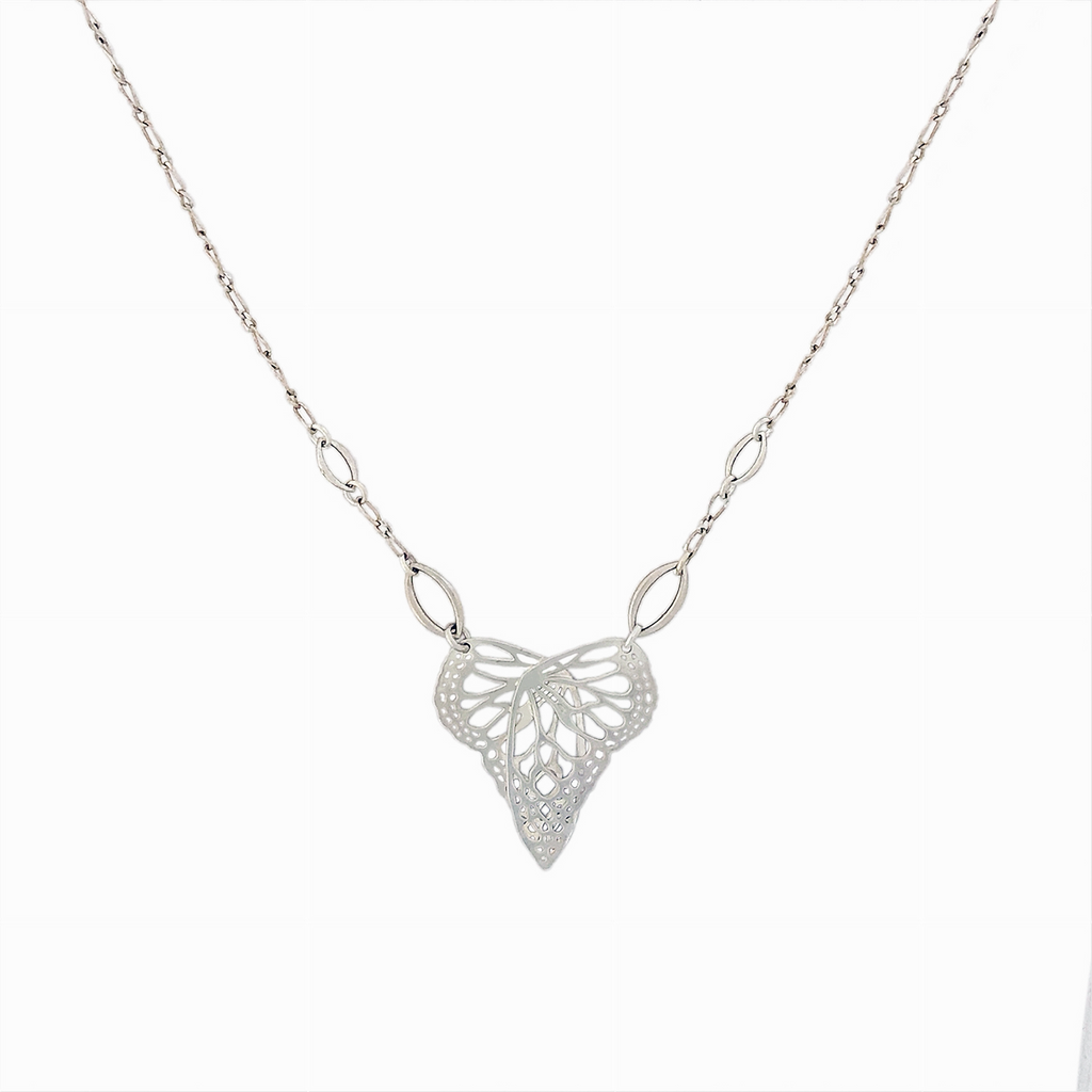 Silver Flutter Butterfly in a heart shaped handcrafted pendant on a chain against a white background | Camille Torres Designs
