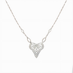 Silver Flutter Butterfly in a heart shaped handcrafted pendant on a chain against a white background | Camille Torres Designs