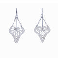 Pair of handcrafted silver heart-shaped butterfly drop earrings suspended from delicate chain on a white background | Camille Torres Designs