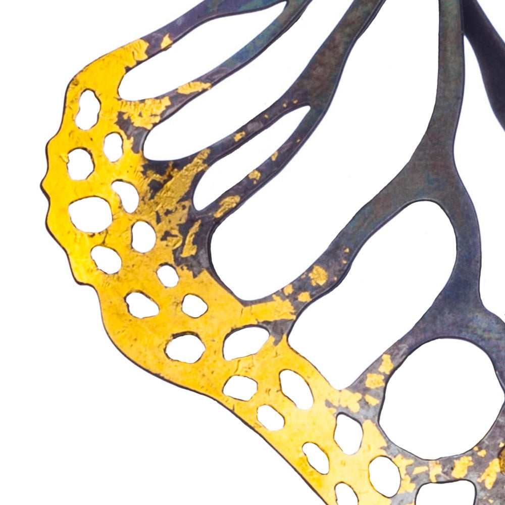 Close-up detail of keum-boo fine jewelry color way with 24k gold fused to oxidized silver on a butterfly wing | Camille Torres Designs