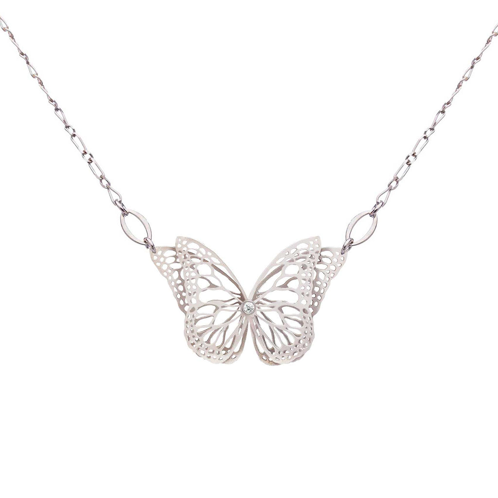 The Migration bright silver butterfly pendant necklace with diamond center and overlapping, 2 wing design, suspended from a delicate silver chain against a plain white background.