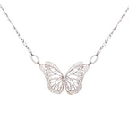 The Migration bright silver butterfly pendant necklace with diamond center and overlapping, 2 wing design, suspended from a delicate silver chain against a plain white background.