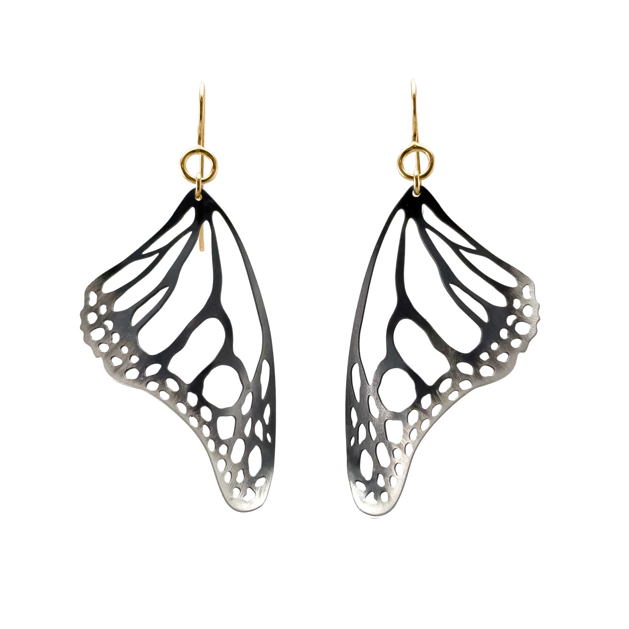 Monarch butterfly wing-shaped black and silver earrings with gold filled ear wire on a white background