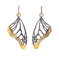 Butterfly drop earrings with keum-boo, 24k gold on oxidized silver over a white background