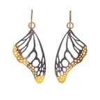 Butterfly drop earrings with keum-boo, 24k gold on oxidized silver over a white background