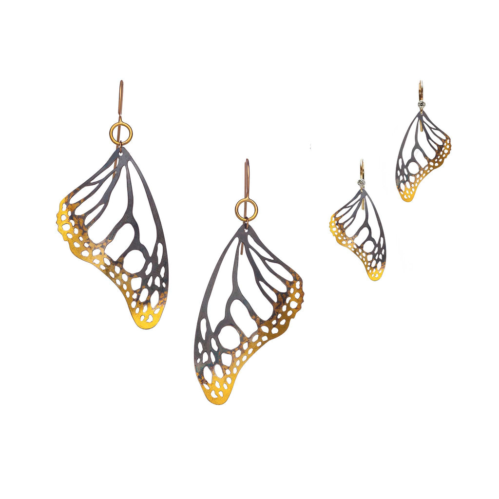 Monarch butterfly keum-boo gold and black wing earrings in large and small sizes on a white background